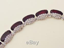 A vintage 1960's unsigned Kramer, ruby rhinestone parure of necklace, brooch and