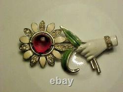 Vintage attributed Coro hand holding flower pin brooch