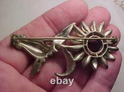 Vintage attributed Coro hand holding flower pin brooch
