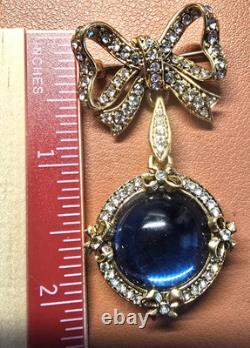Vintage gold tone rhinestones bow dangle blue glass Cabochon designer brooch