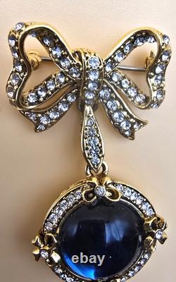 Vintage gold tone rhinestones bow dangle blue glass Cabochon designer brooch