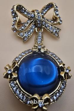 Vintage gold tone rhinestones bow dangle blue glass Cabochon designer brooch