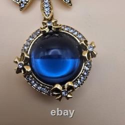 Vintage gold tone rhinestones bow dangle blue glass Cabochon designer brooch